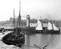 Historical photos of boats and Scarborough harbour