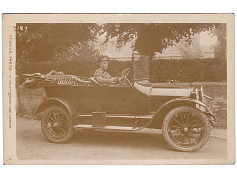 Military driver in car postcard