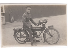 Royal Artillery coporal on Triumph Motorbike postcard