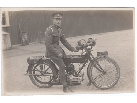 Royal Artillery coporal on Triumph Motorbike postcard